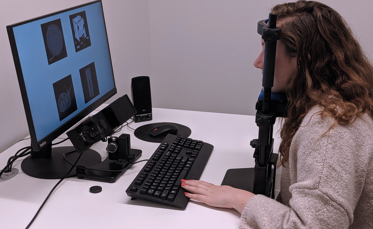 An eye-tracking experiment demonstration by ARiEAL undergraduate trainee, Paige Cater. (Photo Credit: Chia-Yu Lin)